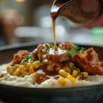 Mashed Potato Bowl Recipe 9 U5778331574 A Hand Drizzling Warm Brown Gravy Over A Bowl Of E43006c5 5ec3 4bc9 Bbc7 0cf057d86e97 3